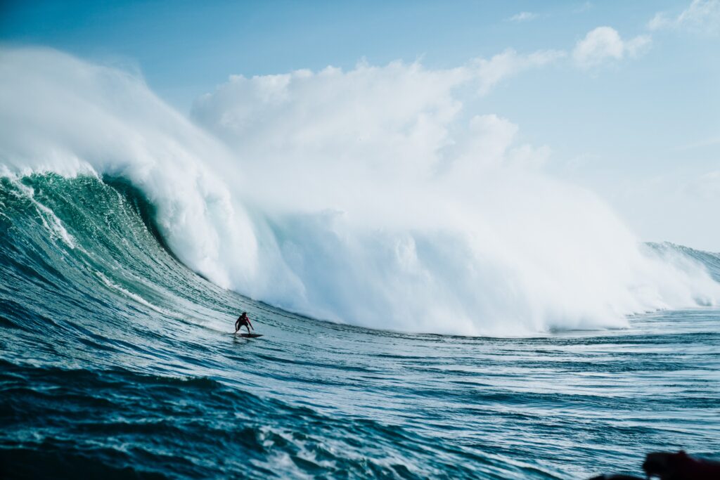 Surfer riding a 20 foot plus wave.